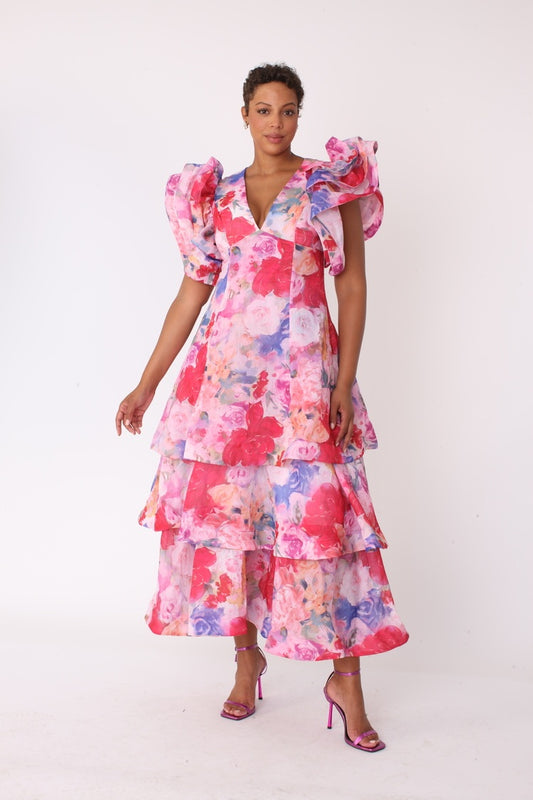 Watercolor floral tiered midi dress shown in front walking pose with statement sleeves by For Her NYC