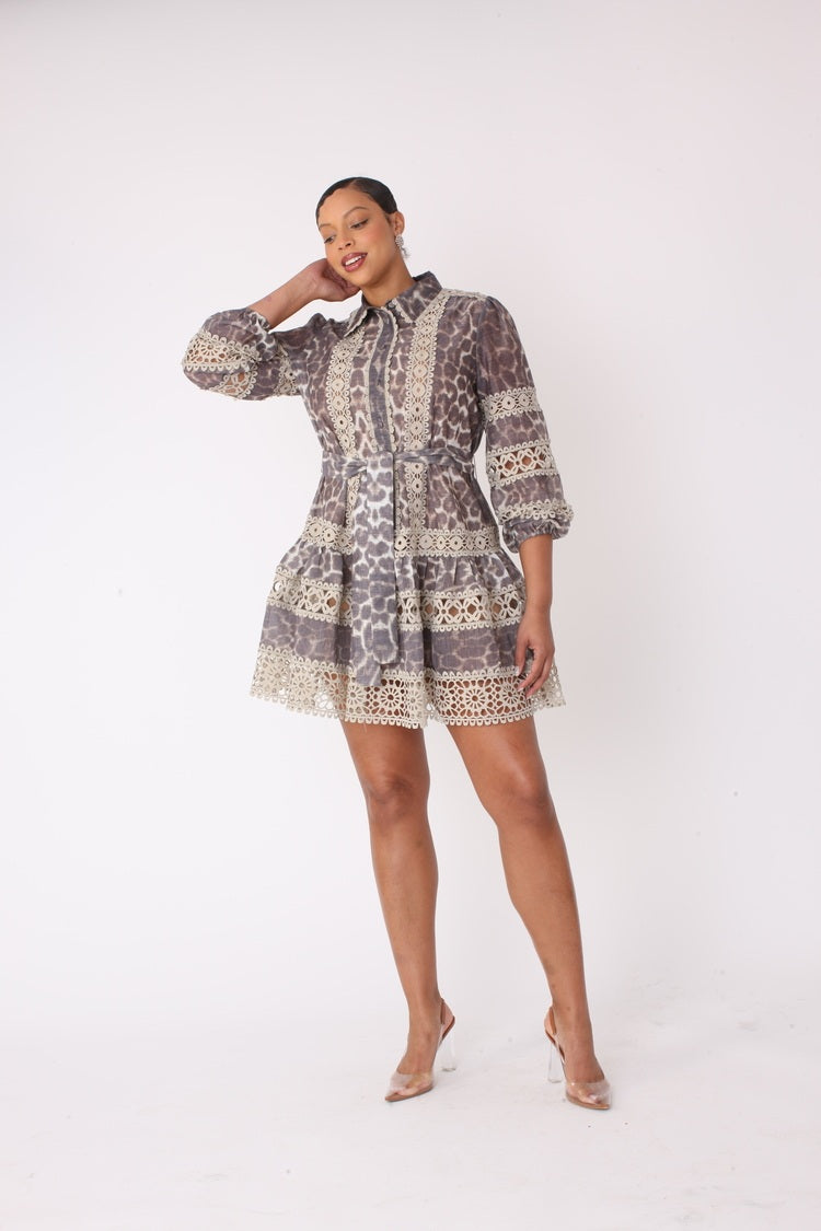 Leopard print mini dress walking pose showcasing intricate lace trim and chic relaxed silhouette.