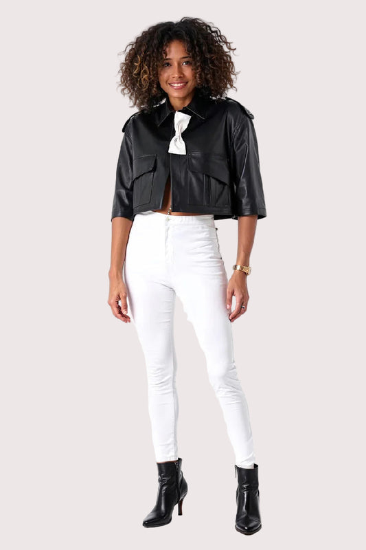 Front full: Black cropped leather jacket with white bow accent, front full body view, For Her NYC.