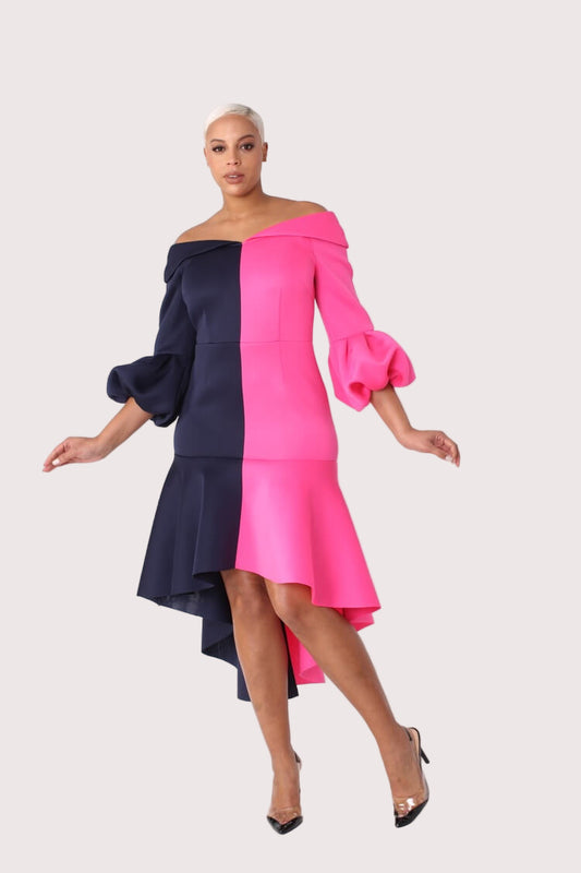 Dramatic flounce sleeve midi dress in navy and fuchsia shown in motion highlighting flowing sleeves and colorblock design by For Her NYC