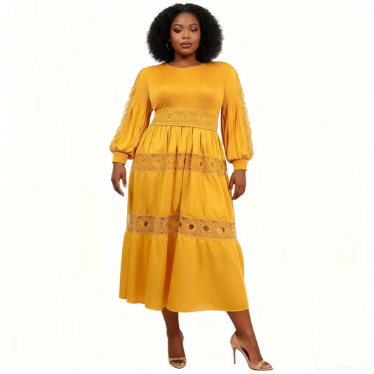 Front view of model wearing a yellow long sleeve tiered midi dress with lace inset detailing and flowing skirt, For Her NYC