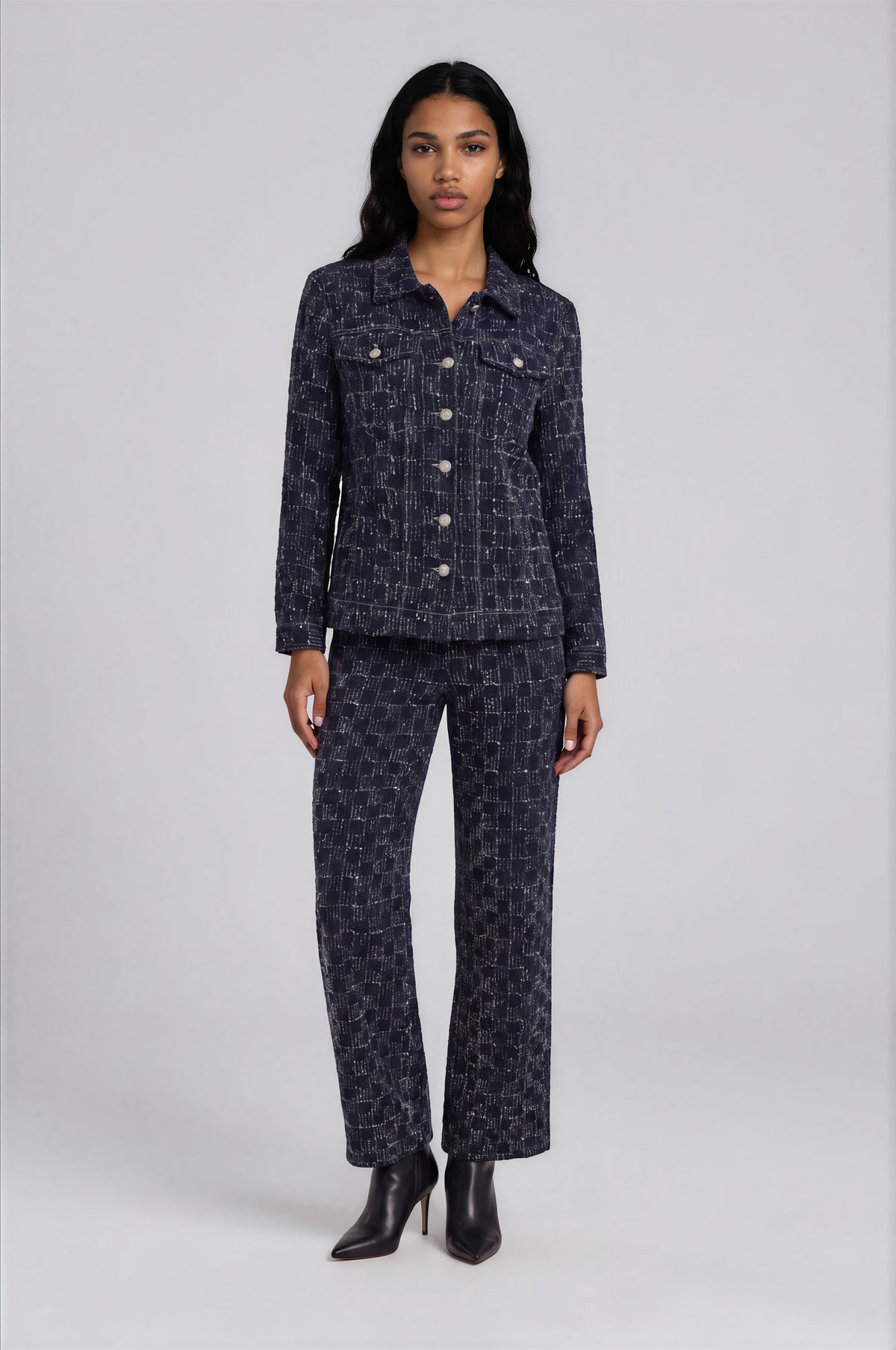 Front view of a model wearing the For Her NYC Dark Wash Textured Wide-Leg Jeans - 83381 with a matching textured denim jacket
