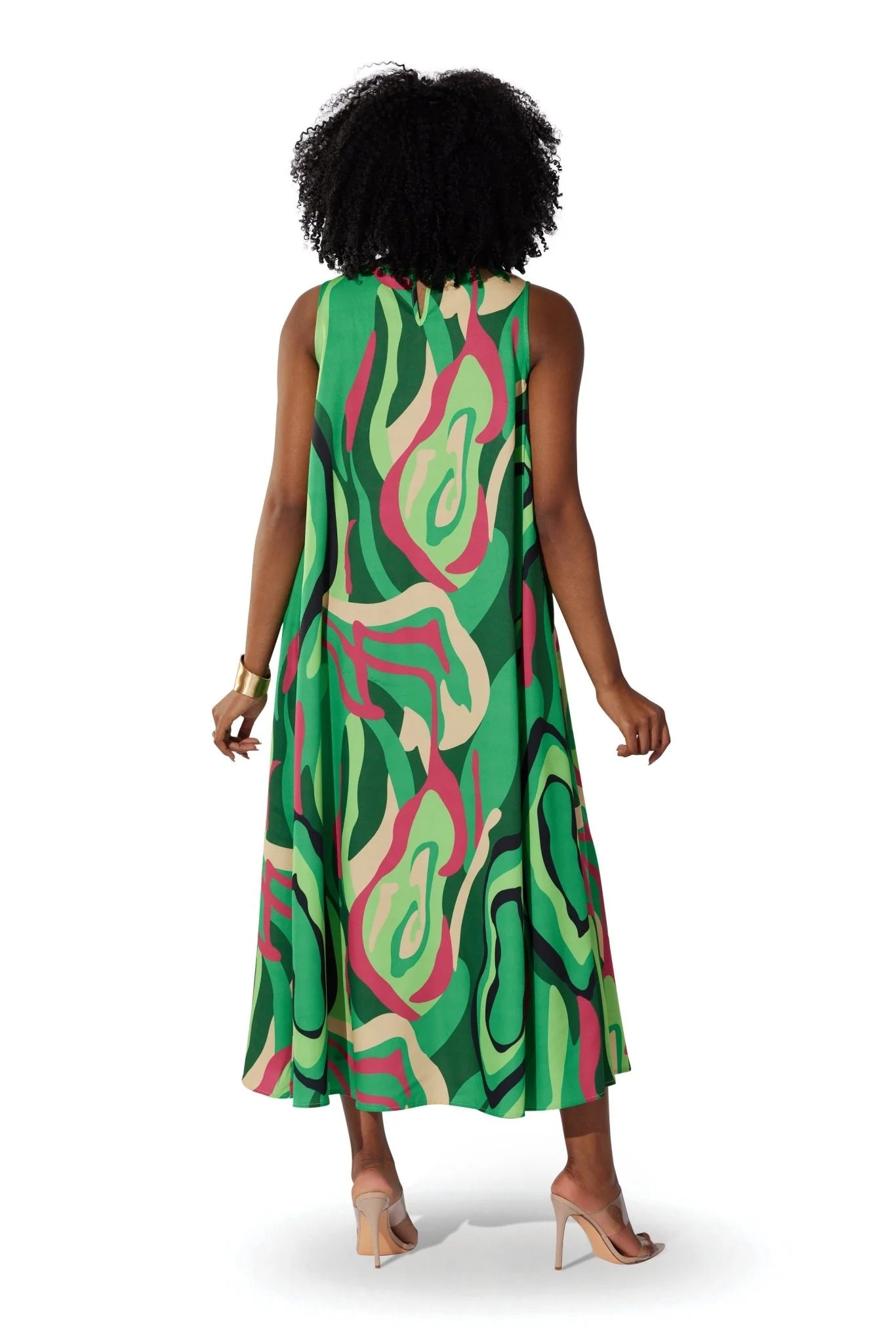 Back view of a model wearing the For Her NYC Oversized Swirls Print Maxi Dress with a vibrant green multicolor abstract swirl print, style S0177.
