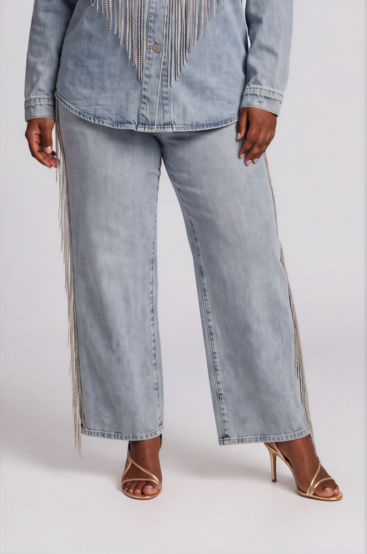Front view of a plus-size model wearing the light-wash For Her NYC Rhinestone Fringe Jean - 82939 with wide legs and rhinestone fringe along the outer seams