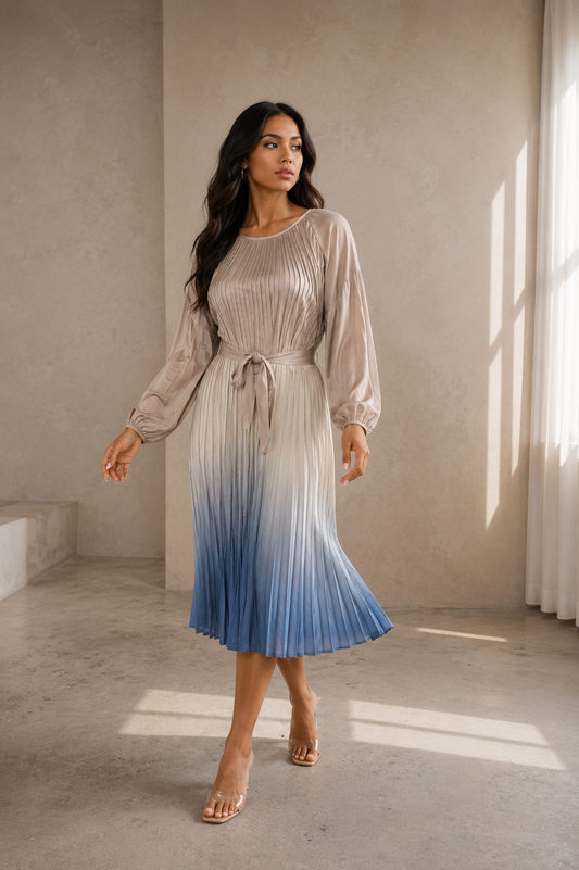 Front View: Gradient pleated midi dress in neutral to blue ombré, long sleeve — For Her NYC
