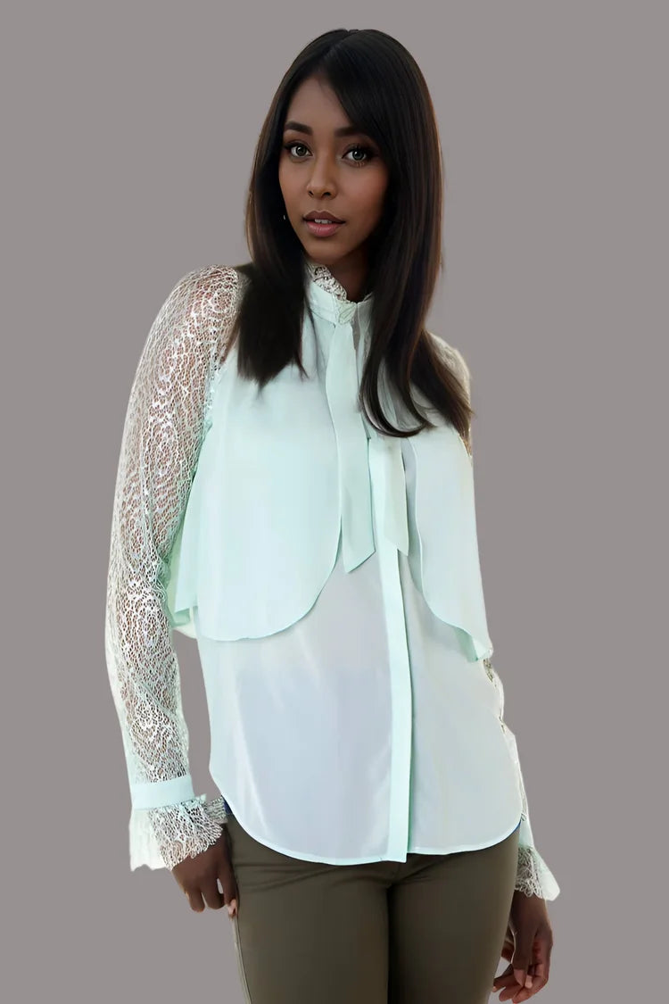 White blouse with lace sleeves and tie neck detail, front studio pose.