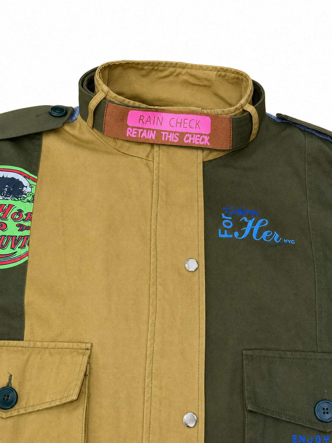 Army green patchwork utility woven jacket with mixed patch detailing and soft woven fabric, seated lifestyle view by For Her NYC