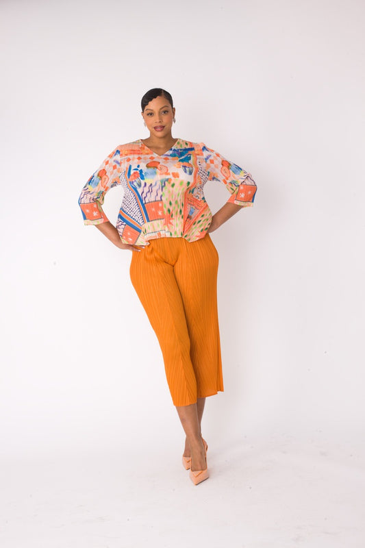 Front full view of a printed top and palazzo pants set in orange multi, featuring a relaxed abstract print top and wide-leg palazzo pants by For Her NYC