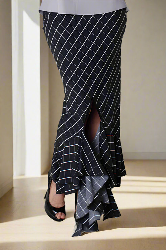 Black and white striped asymmetrical maxi skirt with flowing high-low hem, front view.