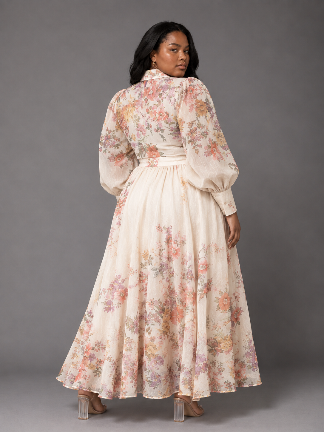 Plus size model showing the back of the Tally Taylor Floral Print Blouse & Maxi Skirt Set in multicolor floral print, long sleeves and a flowing maxi skirt, style S0095W.