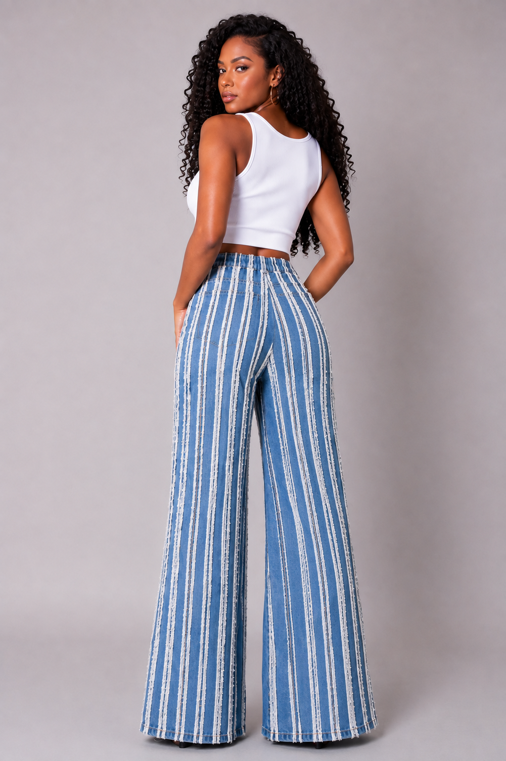 Denim vertical distressed stripe wide-leg jeans with frayed detailing and elongated silhouette front view – For Her NYC