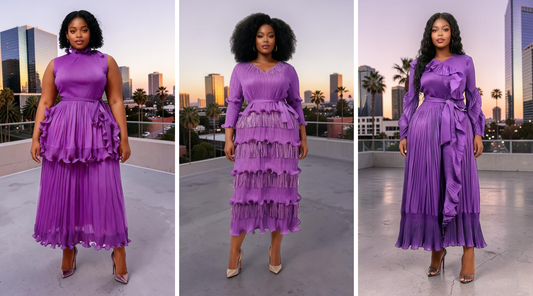 Three women modeling elegant purple pleated midi dresses with ruffle and fringe detailing on a modern rooftop overlooking the downtown Los Angeles skyline at sunset — For Her NYC