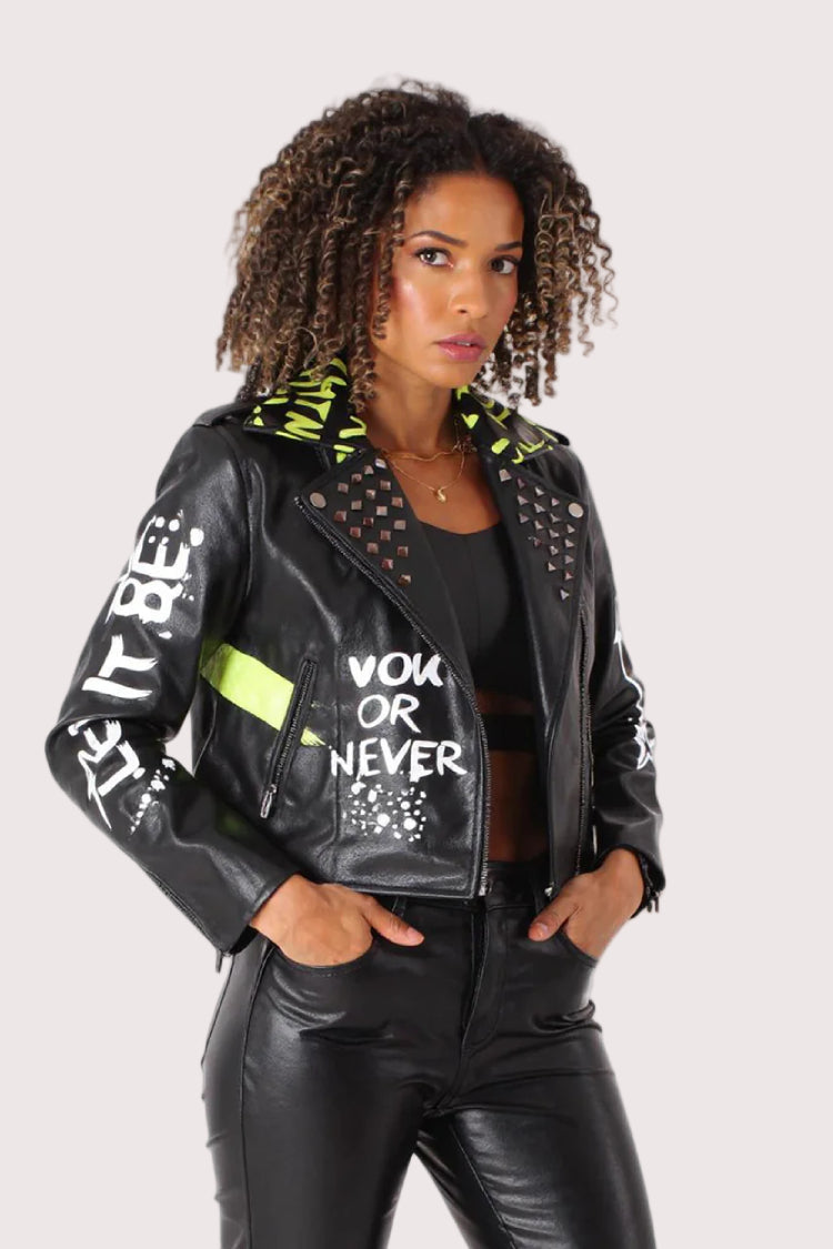 Black and lime vegan leather moto jacket styled open with graphic accents and confident silhouette, alternate front pose, For Her NYC