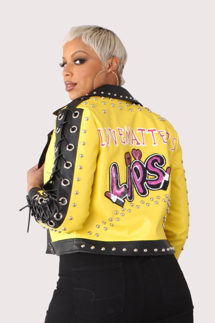 Yellow and black faux leather graffiti jacket showing back view with bold graffiti-inspired graphic, For Her NYC
