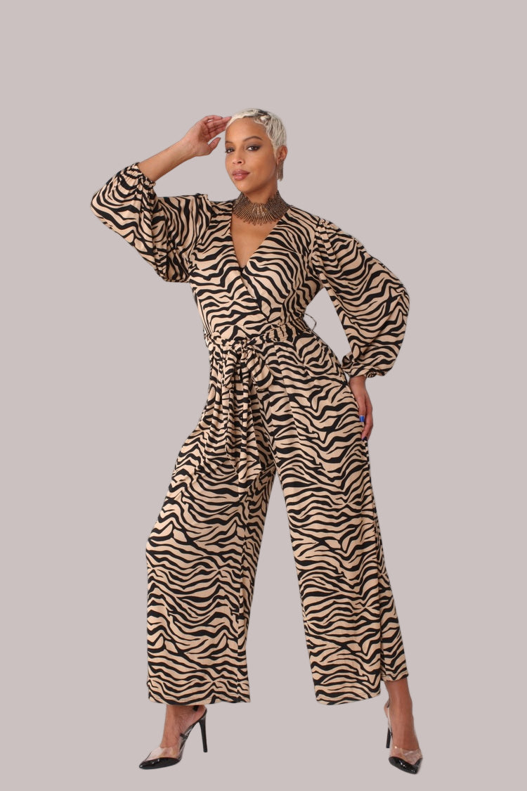 Model wearing coffee and black wide-leg jumpsuit with puff sleeves standing front-facing by For Her NYC