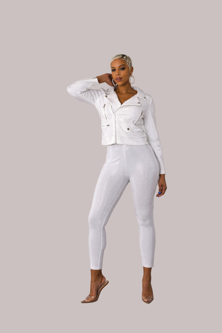 White faux suede moto jacket with allover diamond embellishments style 82022 shown in a walking forward pose highlighting movement and sparkle by For Her NYC