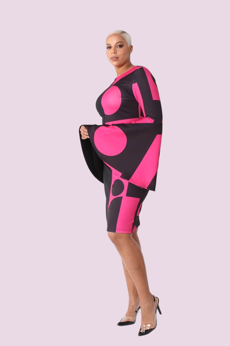 Color block bell sleeve dress style 82062 in black and pink shown in a full-body standing pose highlighting the statement silhouette by For Her NYC
