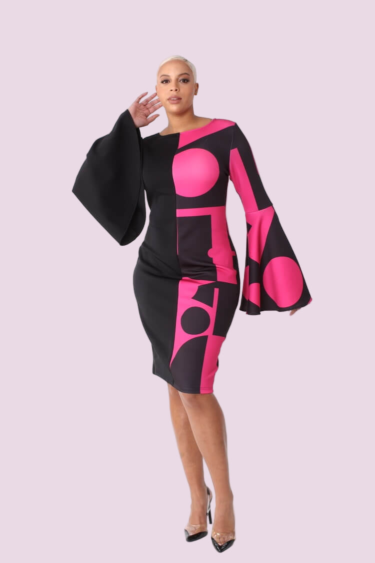 Color block bell sleeve dress style 82062 in black and pink shown in a walking forward pose emphasizing sleeve movement and contrast by For Her NYC