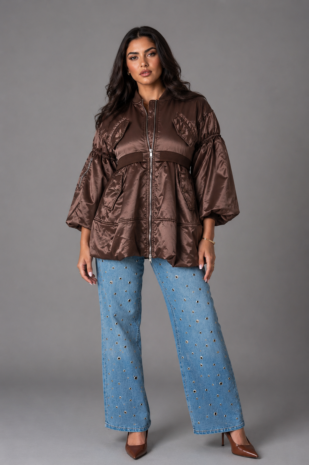 Model wearing brown woven jacket with contrasting lining paired with light wash jeans, standing front pose – For Her NYC