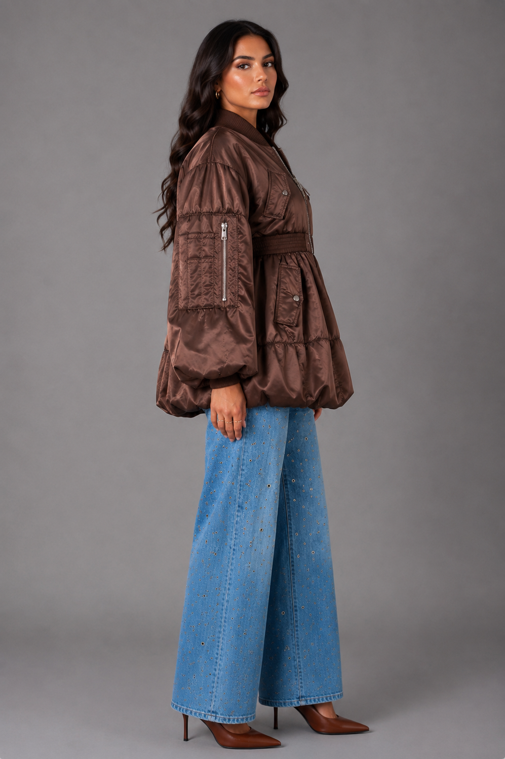 Model wearing brown woven jacket with contrasting lining paired with light wash jeans, standing front pose – For Her NYC