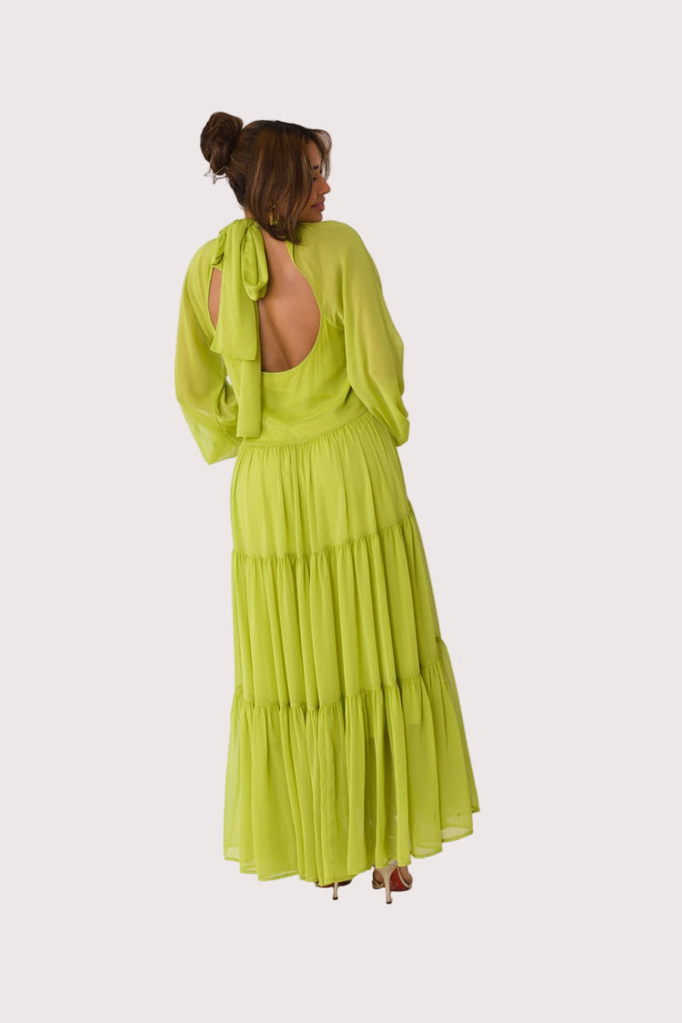 Chartreuse Dream tiered maxi dress style 82348 in lemon grass shown from a back angle in a subtle motion pose highlighting the fluid silhouette and lightweight chiffon by For Her NYC