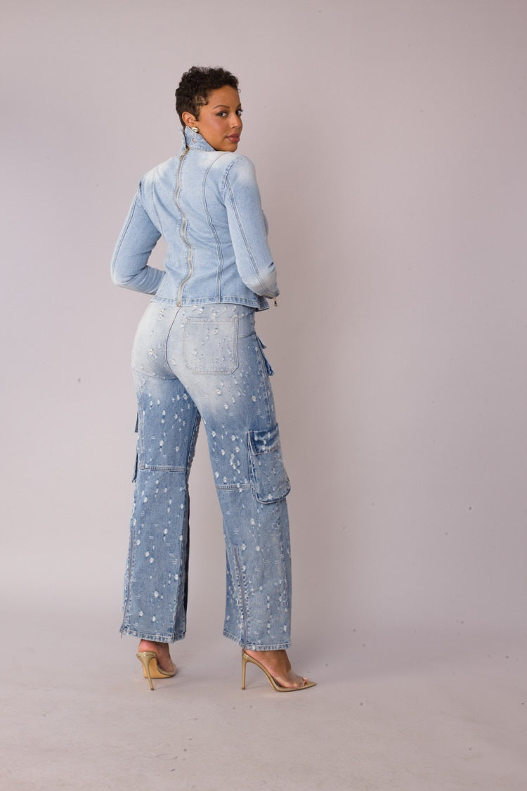 Model posing in bow detail denim top, side angle view highlighting structured tailoring, For Her NYC