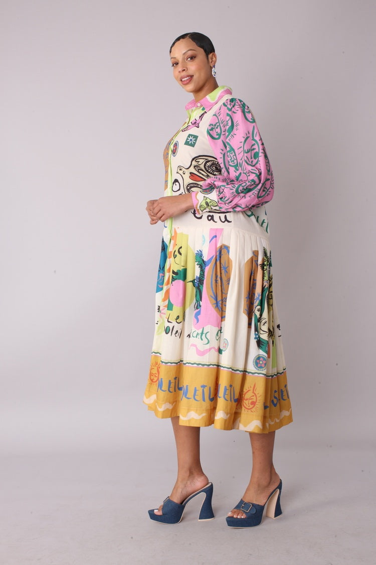 Model walking in artistic print shirt dress with colorful illustrated print, flowing skirt movement, For Her NYC