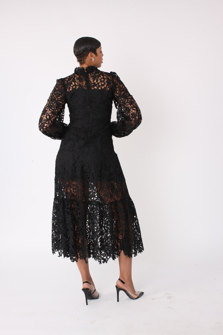 Back view of black lace midi dress featuring floral guipure lace and midi length, For Her NYC