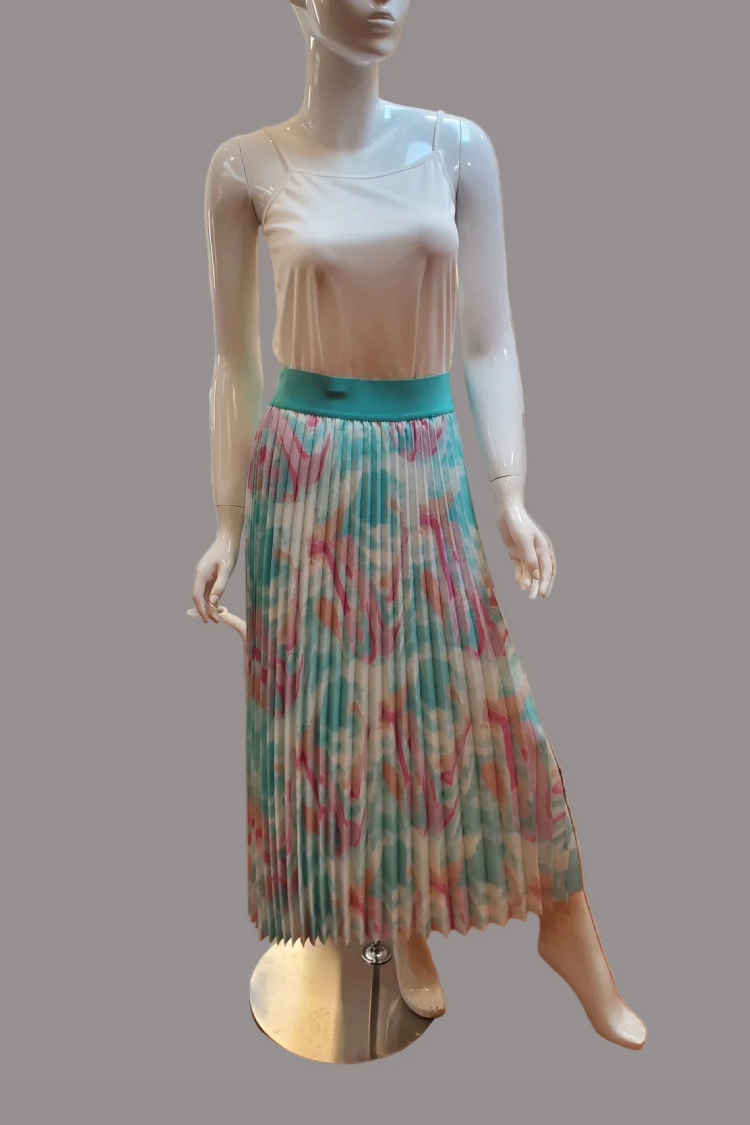 Watercolor print pleated maxi skirt in blue multi, model walking with flowing movement, For Her NYC
