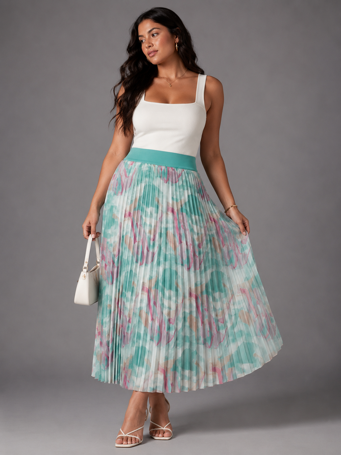 Watercolor print pleated maxi skirt in blue/multi, model walking with flowing movement, For Her NYC