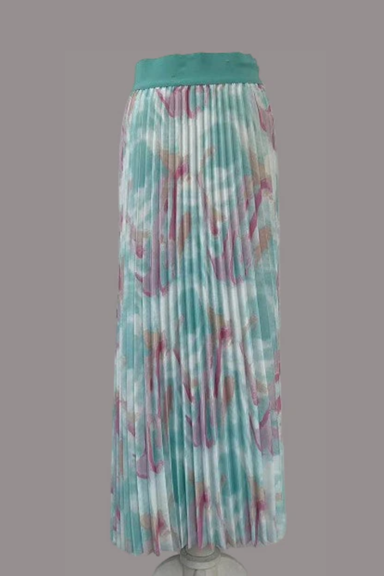 Watercolor print pleated maxi skirt in green multi, model walking with movement, For Her NYC