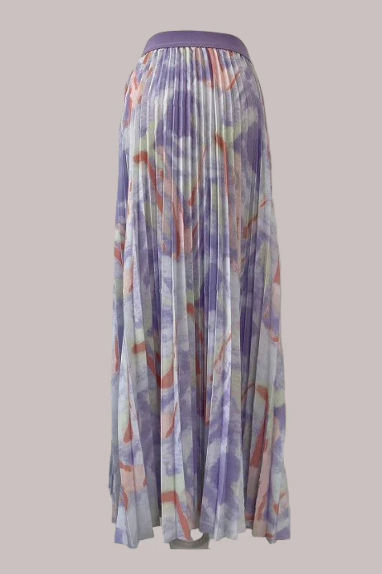 Watercolor print pleated maxi skirt in purple multi, model standing front view, For Her NYC