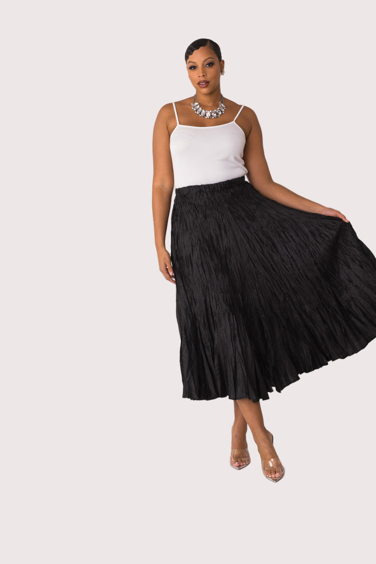 Elastic waist crinkle maxi skirt in black, model walking with flowing movement, For Her NYC