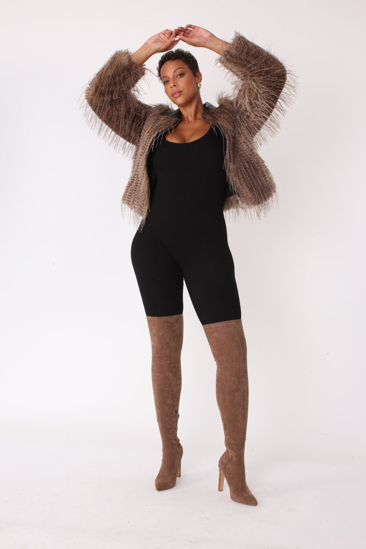 Beige and black shaggy faux fur bomber jacket shown with arms raised highlighting dramatic texture and cropped silhouette by For Her NYC
