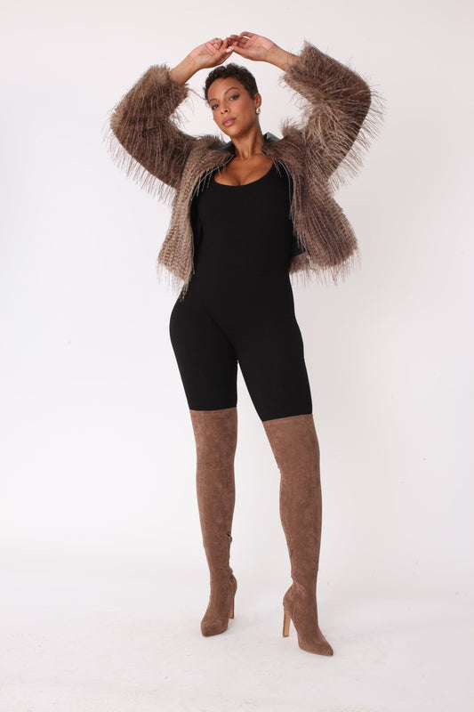 Beige and black shaggy faux fur bomber jacket shown with arms raised highlighting dramatic texture and cropped silhouette by For Her NYC