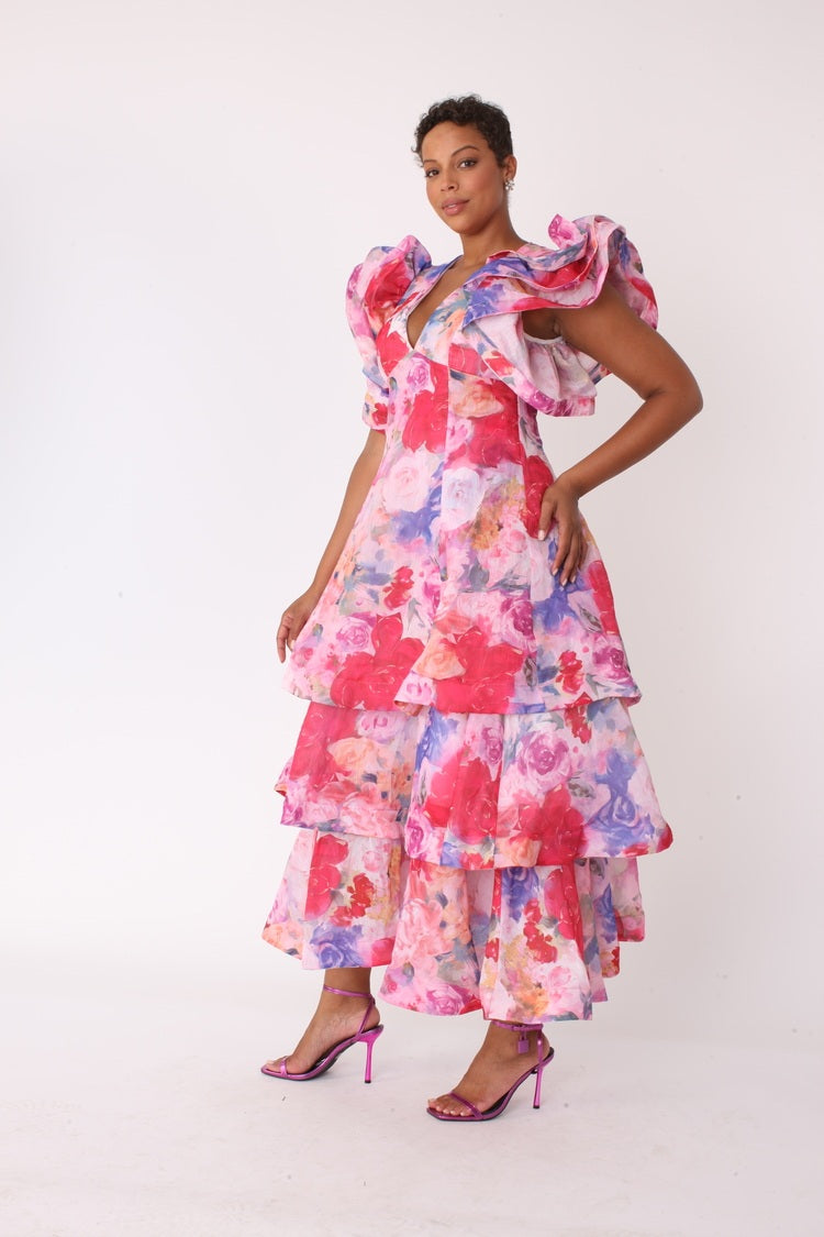Watercolor floral tiered midi dress shown in front pose with hand on hip by For Her NYC