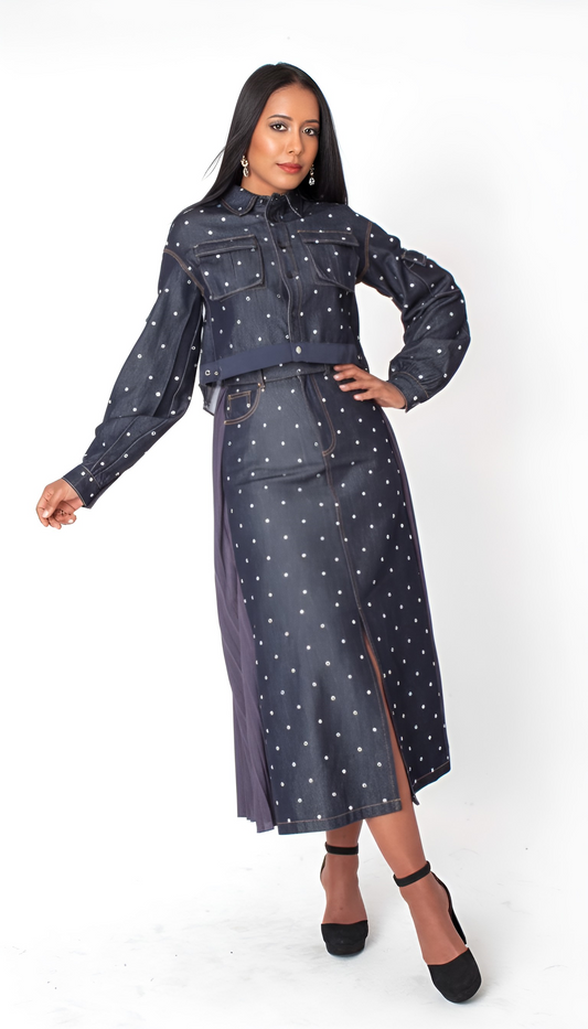 Midnight stud denim set with cropped studded jacket and matching maxi skirt, model standing with hand on hip For Her NYC