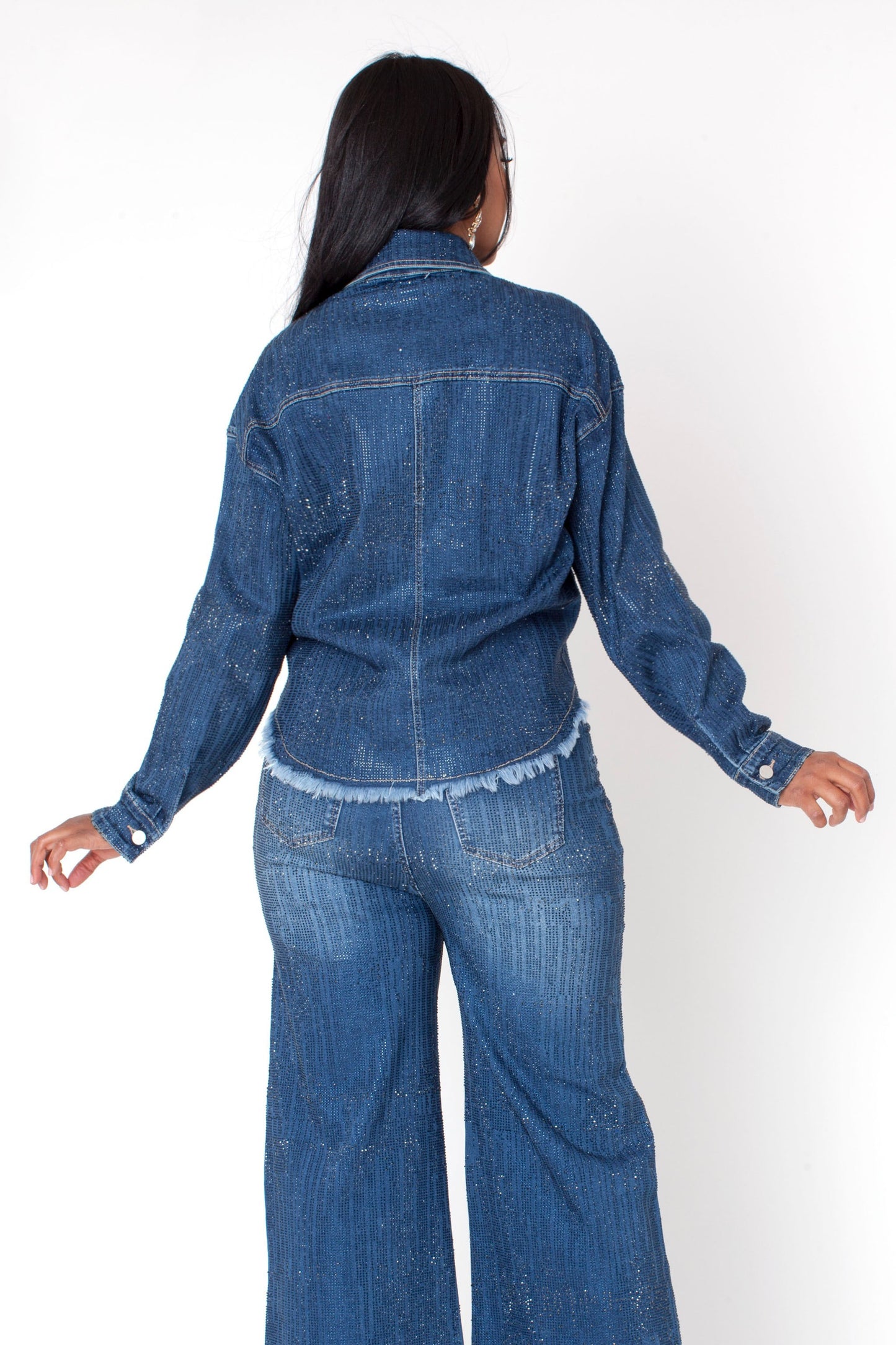 Rhinestone embellished denim jacket with classic denim wash and button front, model showing back view with matching denim jeans For Her NYC