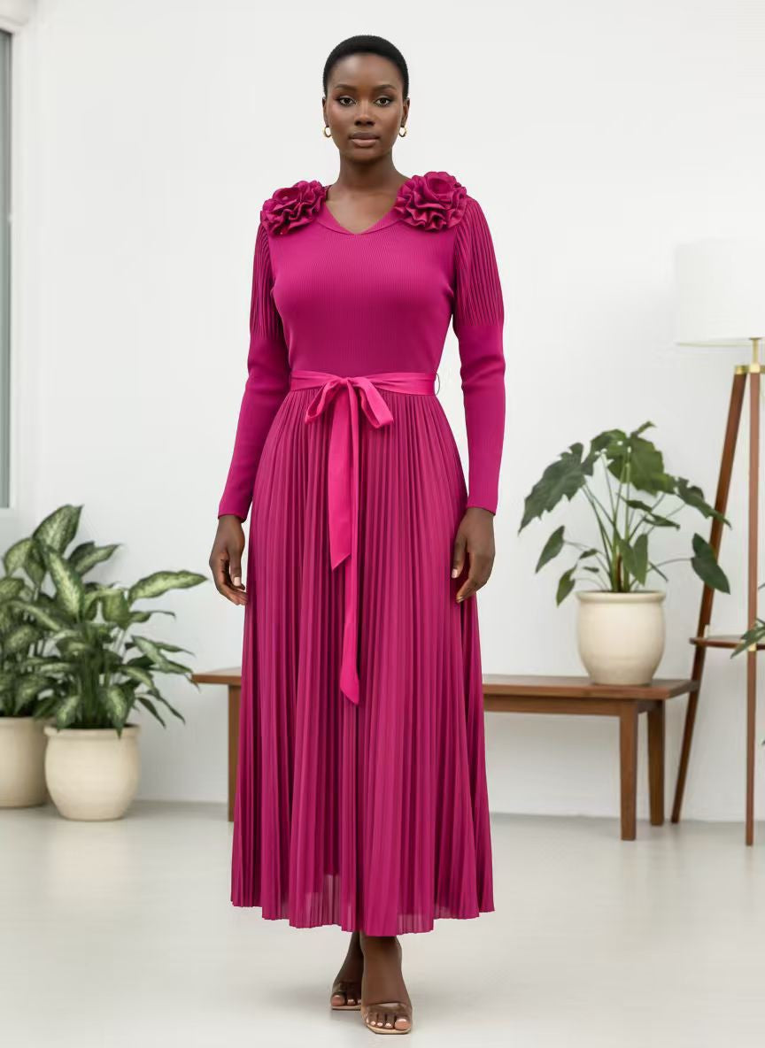 For Her NYC 83003 Pink pleated maxi dress with long sleeves, floral shoulder accents, V-neckline, tie waist, and flowing skirt 