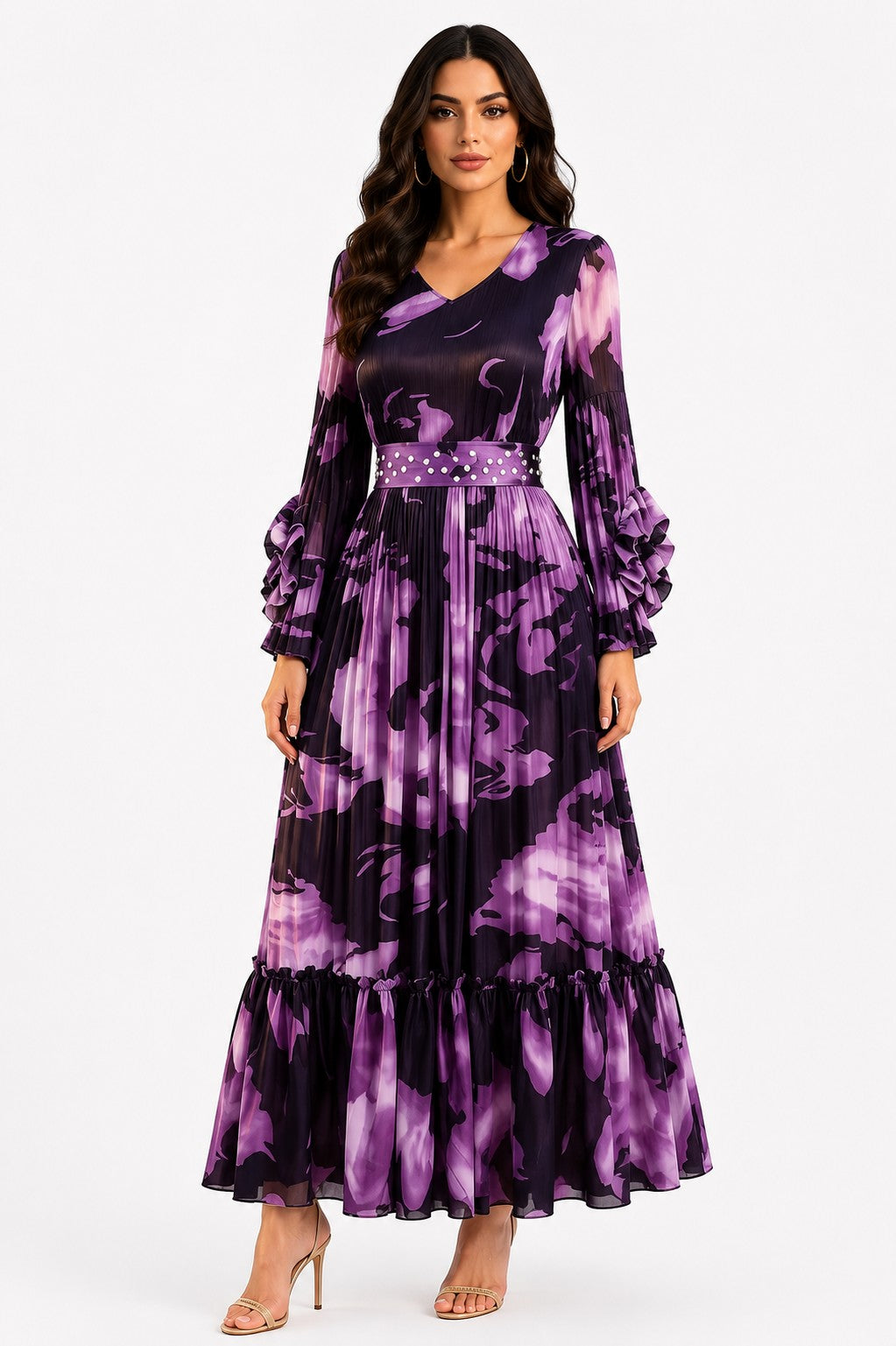 Model wearing the Printed Tiered Pleated Maxi Dress in Purple featuring a vibrant abstract print, flowing pleated tiers, long sleeves, and a graceful maxi silhouette by For Her NYC