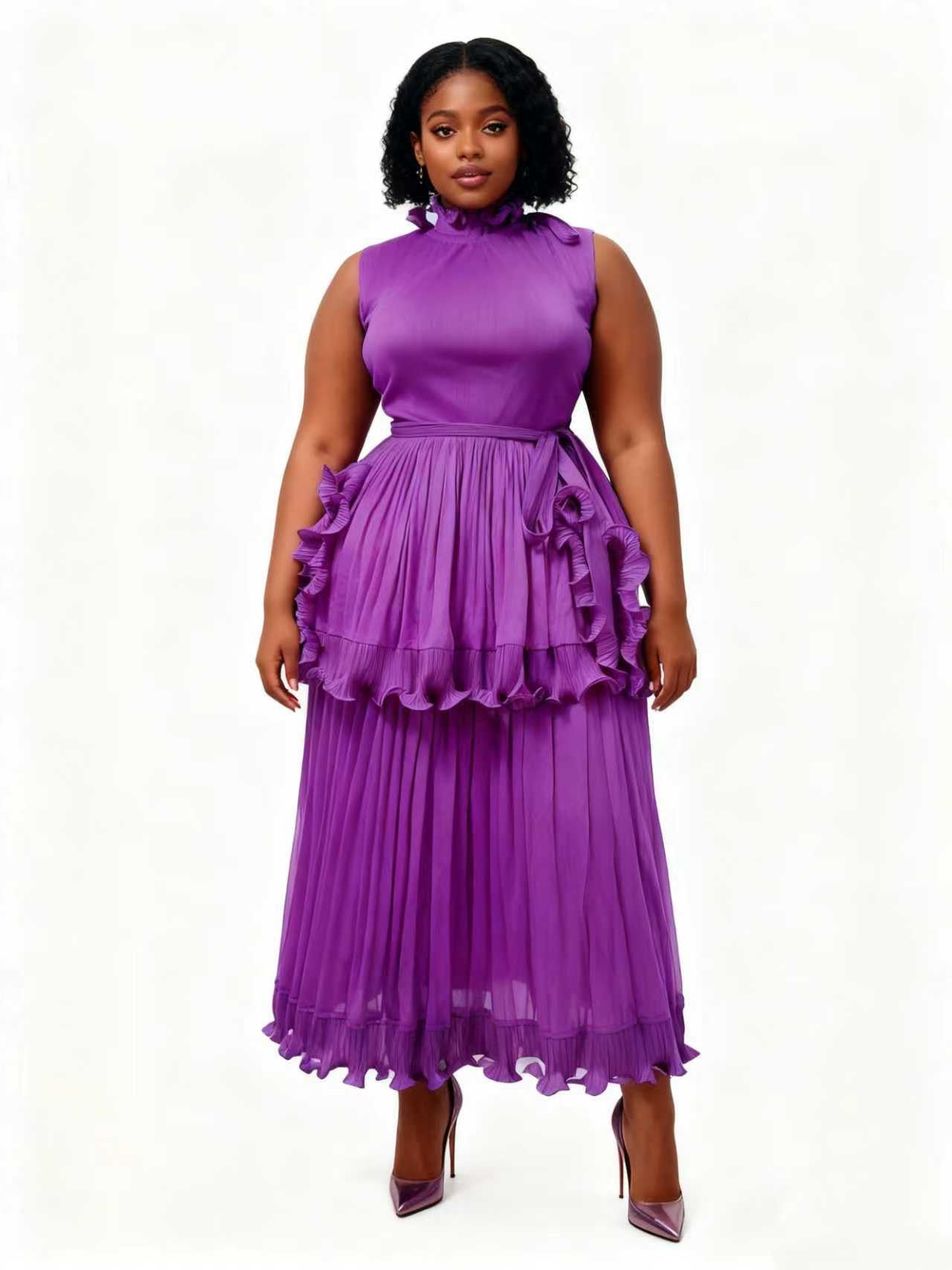 Woman wearing a purple ruffle tiered pleated midi dress with a gathered neckline and defined waist tie, styled with heels — For Her NYC
