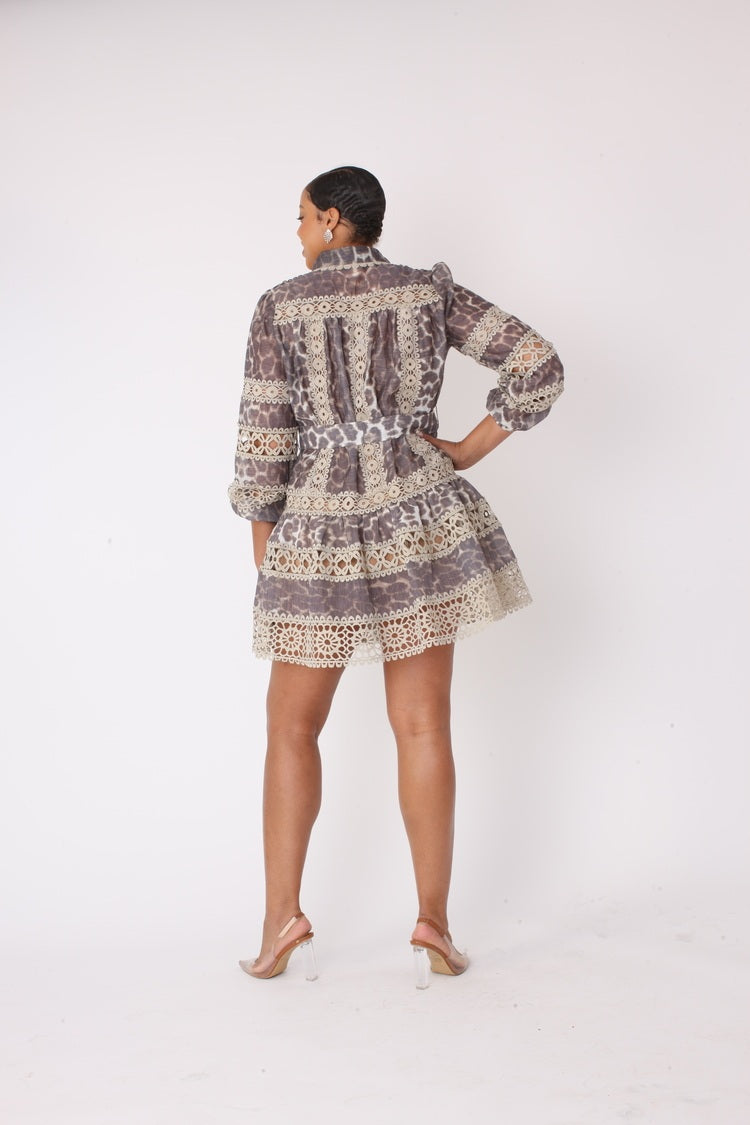 Back view of leopard print lace dress with soft silky fabric movement.