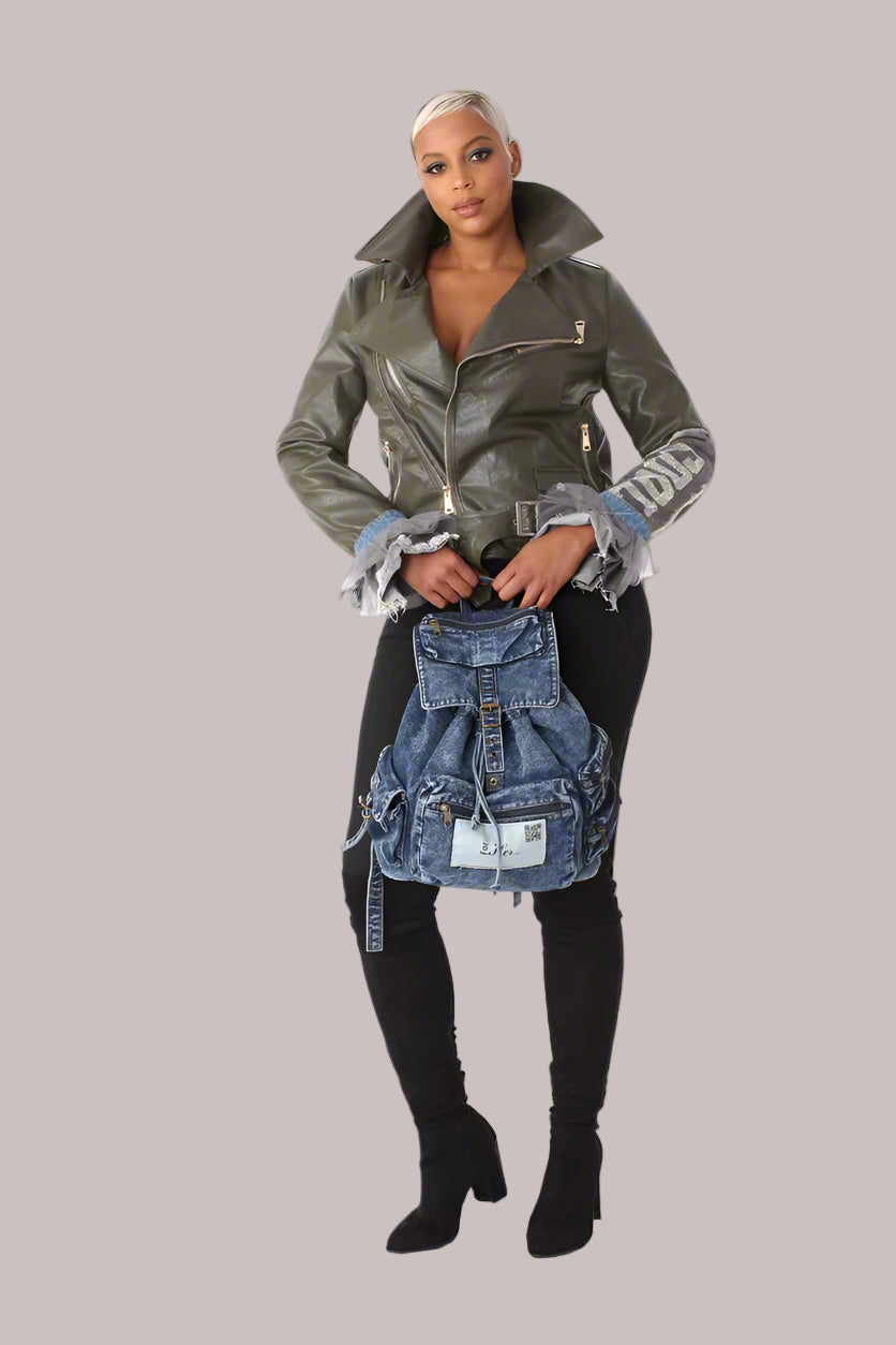 Front pose of army green faux leather moto jacket styled with black pants showing statement rhinestone COOL embellishment.