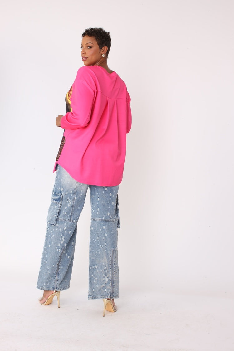 Back view of model wearing the fuchsia artistic portrait graphic long sleeve t shirt showing clean back and long sleeve silhouette by For Her NYC