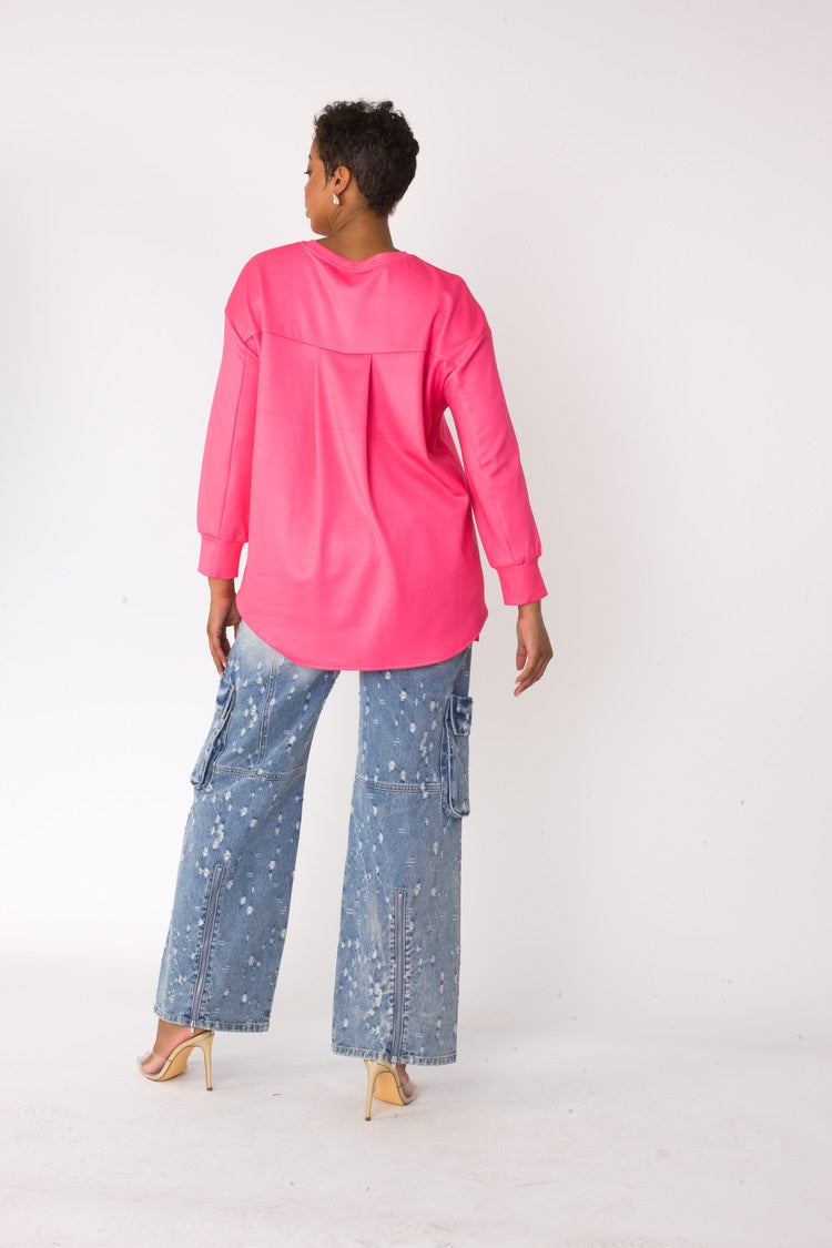 Back view of model wearing the fuchsia artistic portrait graphic long sleeve t shirt showing clean back and long sleeve silhouette by For Her NYC