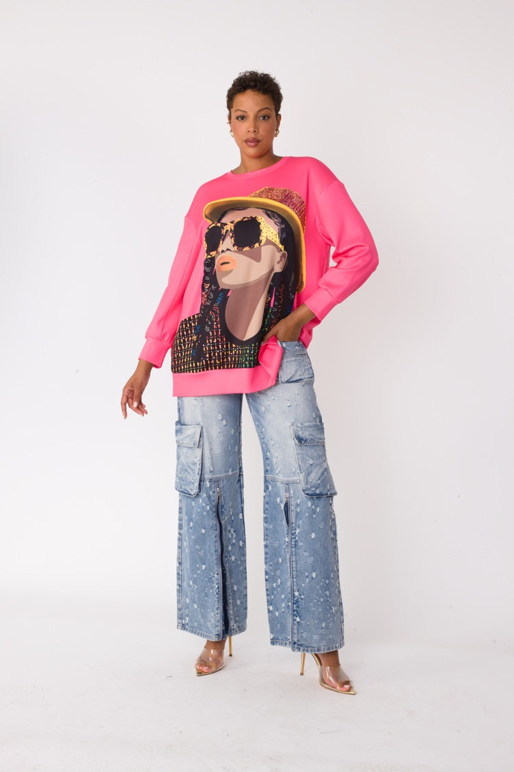 Model wearing the fuchsia artistic portrait graphic long sleeve t shirt standing front facing, highlighting vibrant color and bold portrait graphic by For Her NYC