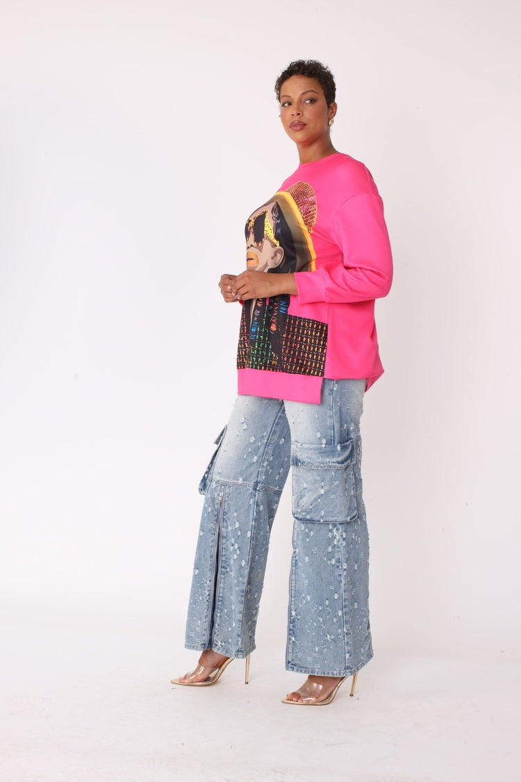 Three quarter angled view of model wearing the fuchsia artistic portrait graphic long sleeve t shirt, highlighting bold portrait artwork, relaxed fit, and casual statement styling by For Her NYC