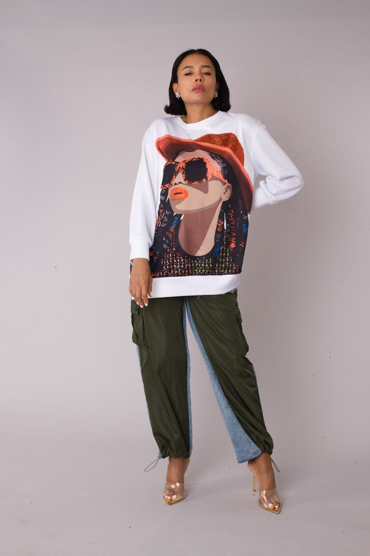 Model wearing the white artistic portrait graphic long sleeve t shirt standing front facing, showcasing contrast portrait print and relaxed everyday fit by For Her NYC