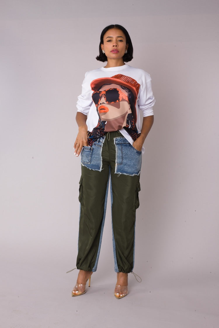 Model wearing the white artistic portrait graphic long sleeve t shirt standing front facing, showcasing contrast portrait print and relaxed everyday fit by For Her NYC