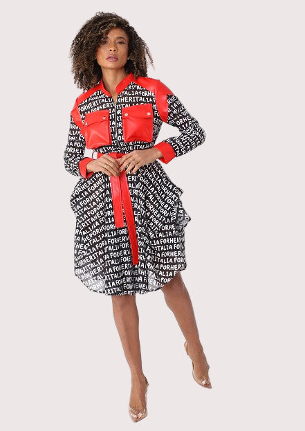 Front view of belted graphic print jacket dress with contrast leather trim and red waist tie highlighting tailored silhouette and bold pattern by For Her NYC